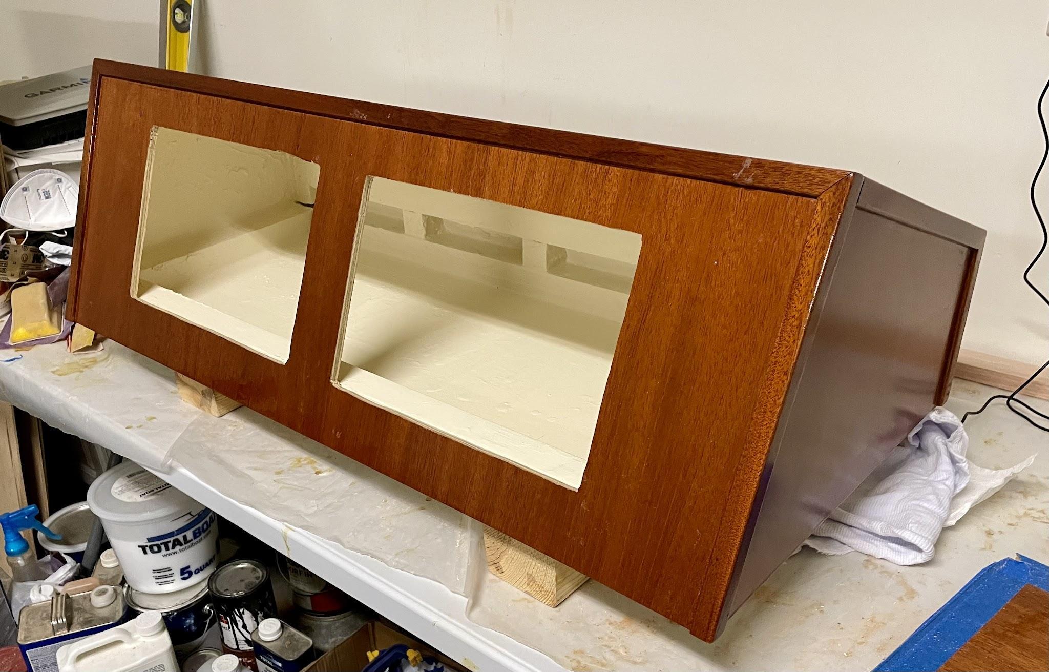 Mahogany pilothouse console cabinet with openings for two chartplotters