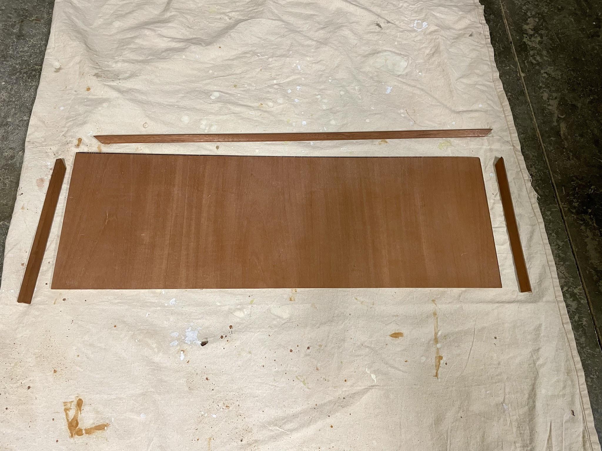 Mahogany veneer front panel and corner-round trim ready for assembly