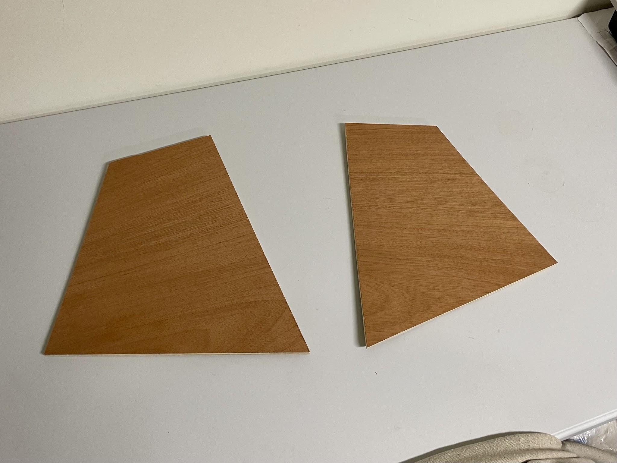 Two mahogany veneer side panels cut to match the prototype