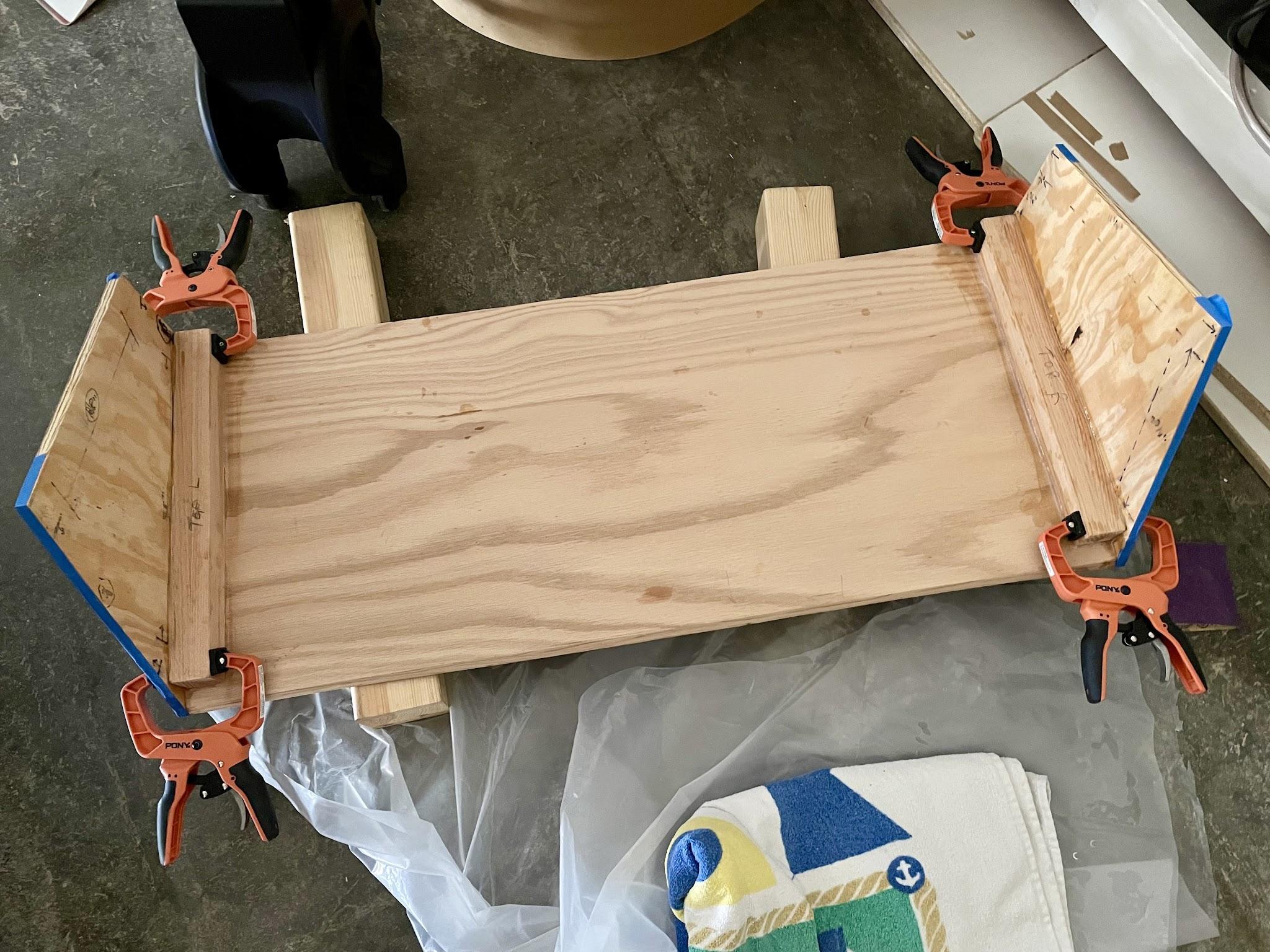 Mahogany side panels epoxied to the console base supports