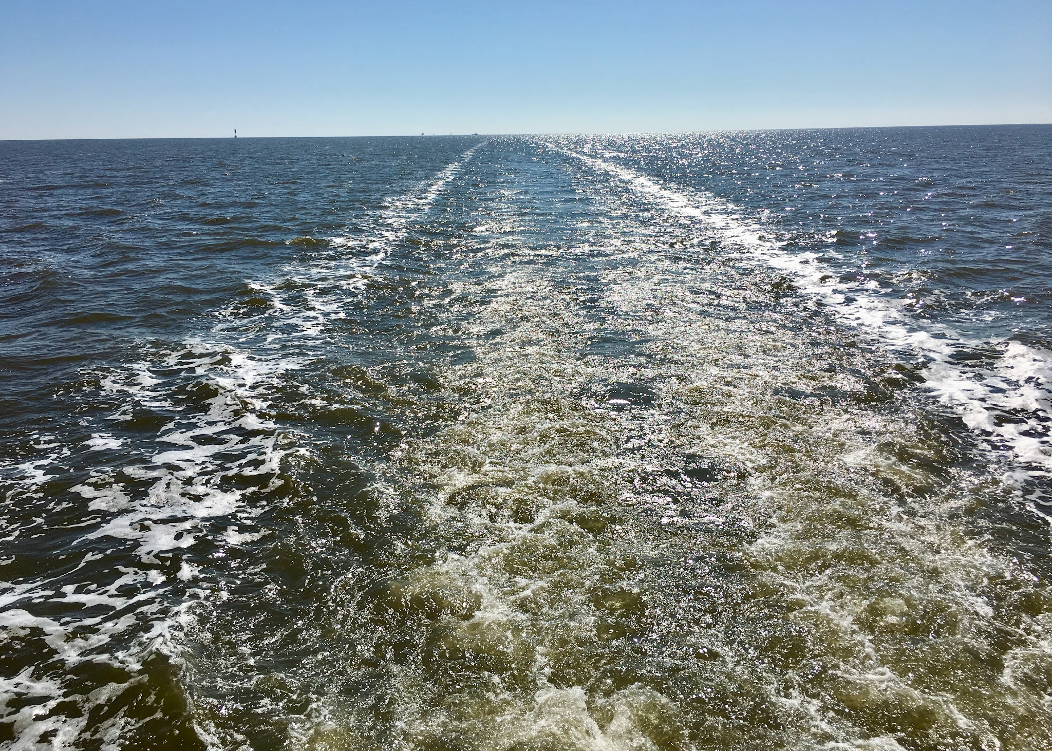 Hunky Dory’s wake stretching across Mobile Bay on the return to Turner Marine